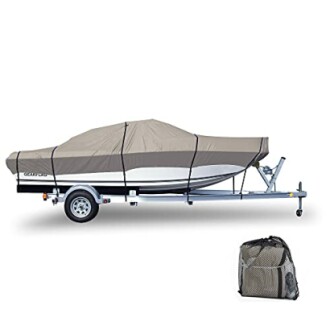 Boat on trailer covered with grey tarp, includes storage bag